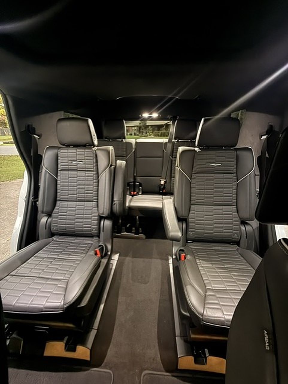 Quilted leather captain's chairs and third-row seating inside the Cadillac Escalade